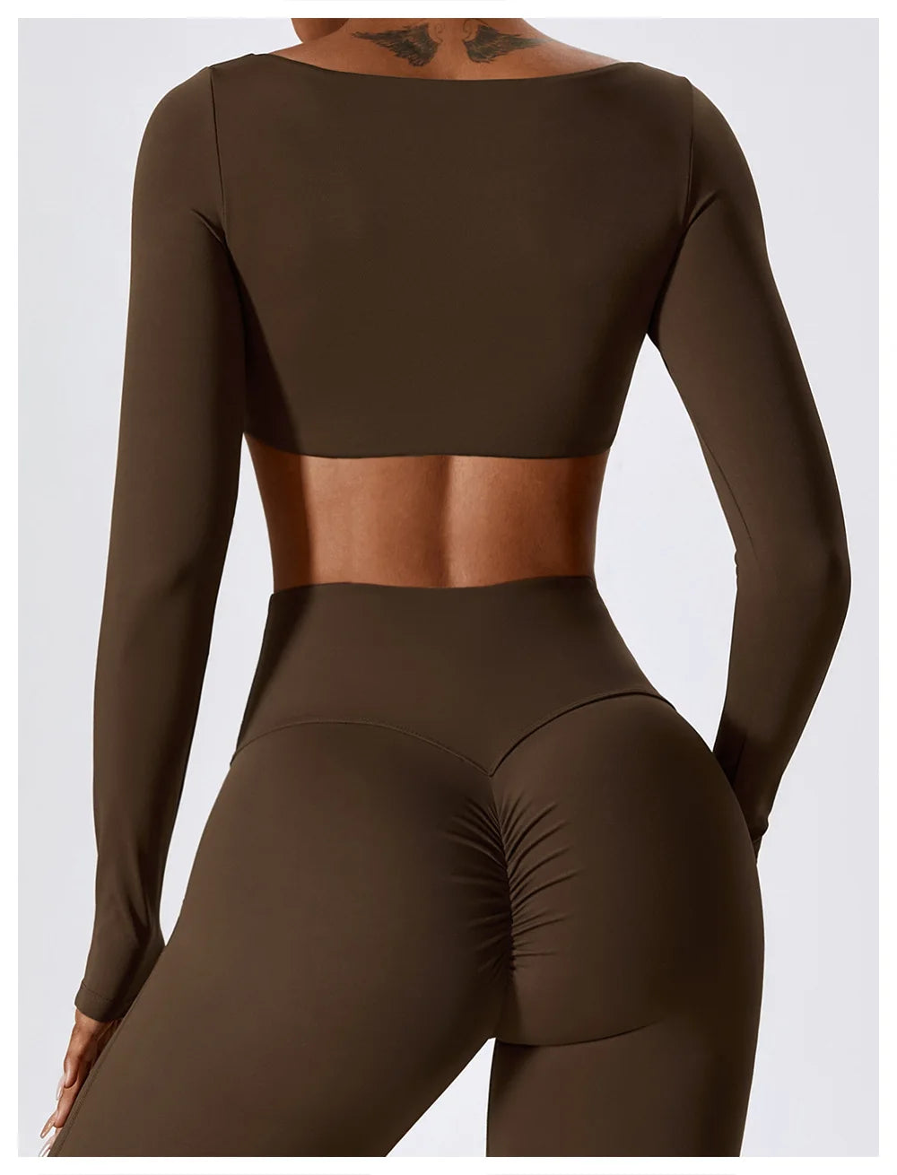 Brown long-sleeve crop top and leggings set on a white background