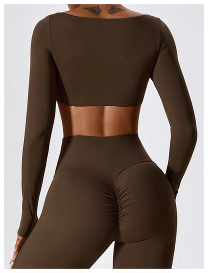 Brown long-sleeve crop top and leggings set on a white background