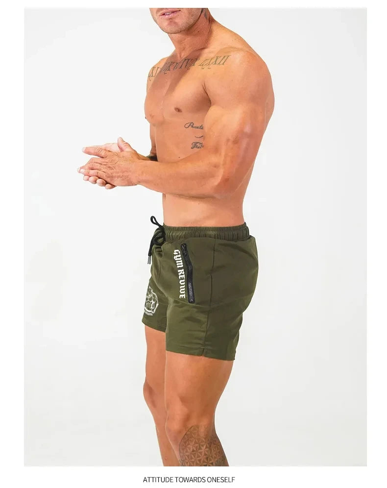 Man wearing green shorts with a visible brand logo on a white background