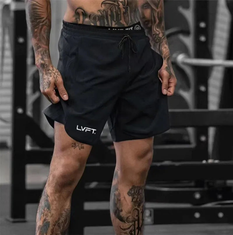 Person wearing black shorts with 'LVFT' branding in a gym setting