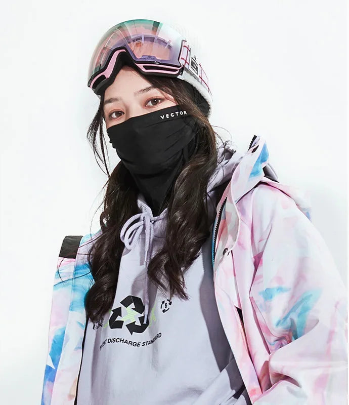 Person wearing a colorful jacket, white shirt with a logo, and black mask with 'VECTOR' branding.