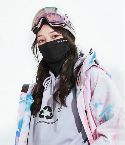 Person wearing a colorful jacket, white shirt with a logo, and black mask with 'VECTOR' branding.