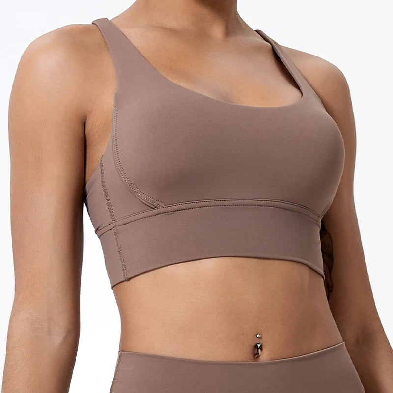 Brown sports bra and leggings on a plain background