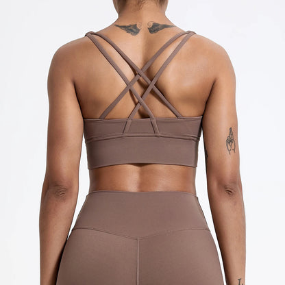 Brown sports bra and leggings set on a plain background