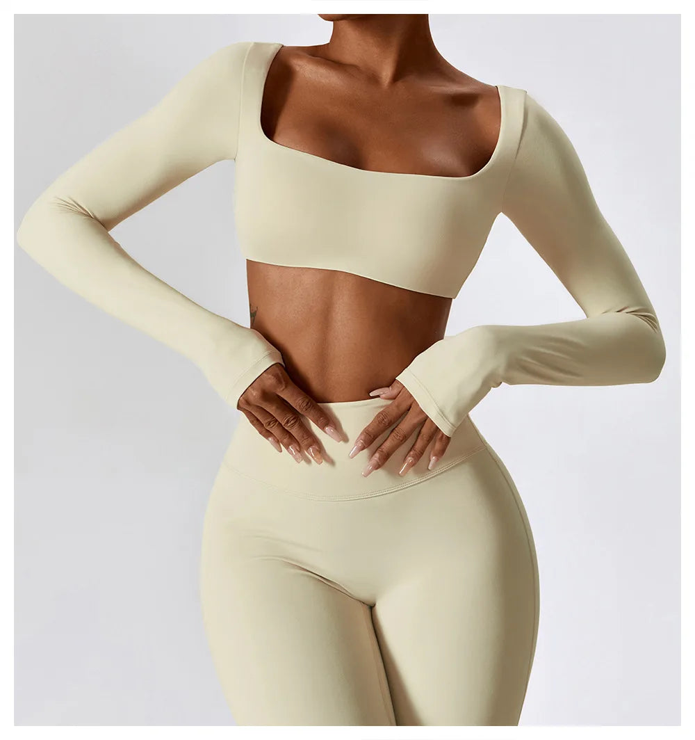 Beige long-sleeve top and leggings set on a plain background