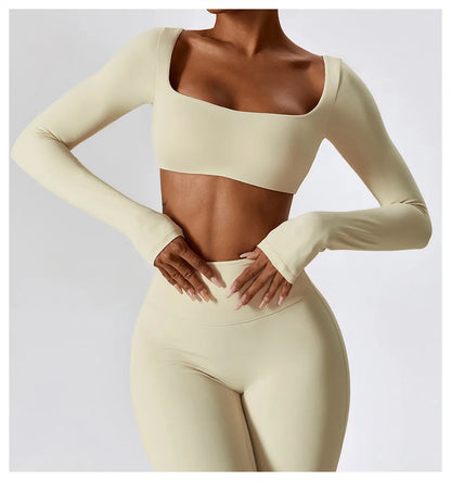 Beige long-sleeve top and leggings set on a plain background